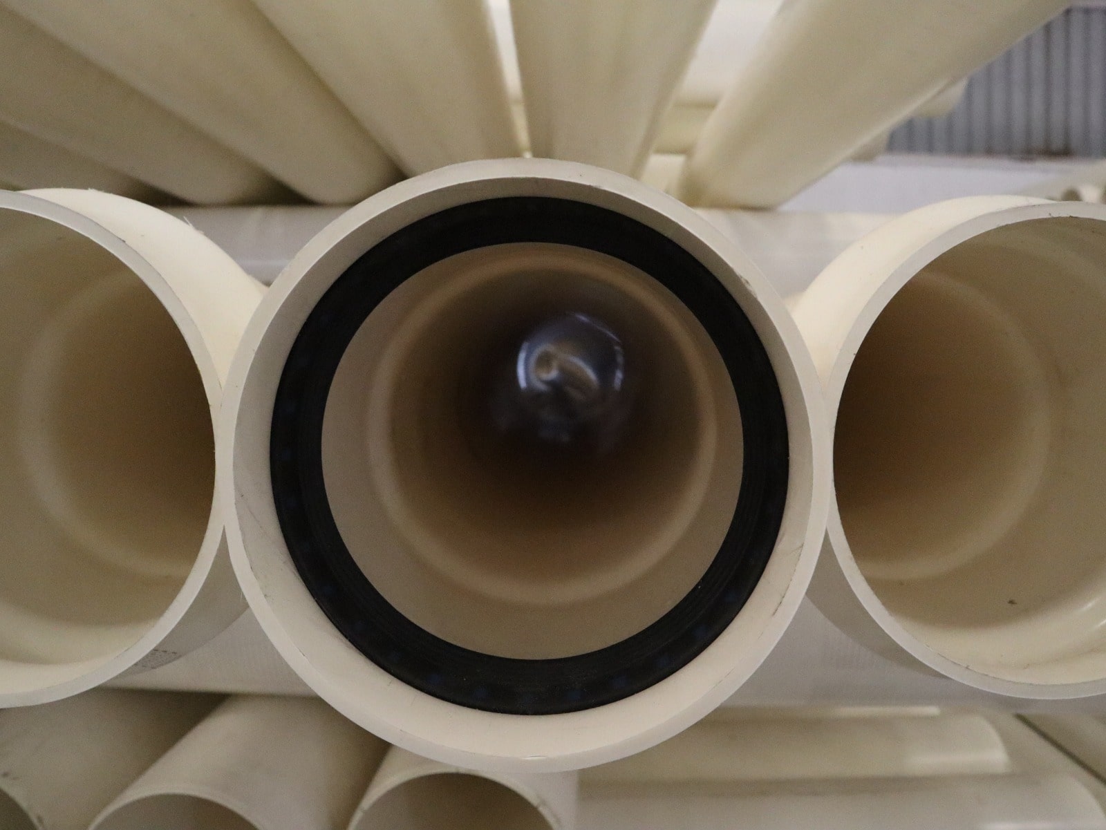 Construction worker woman in safety gear holding clipboard